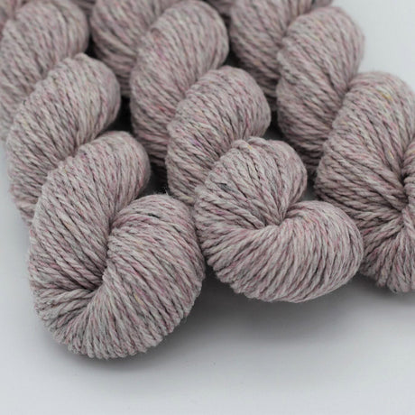 Pink yarn skeins on a white background