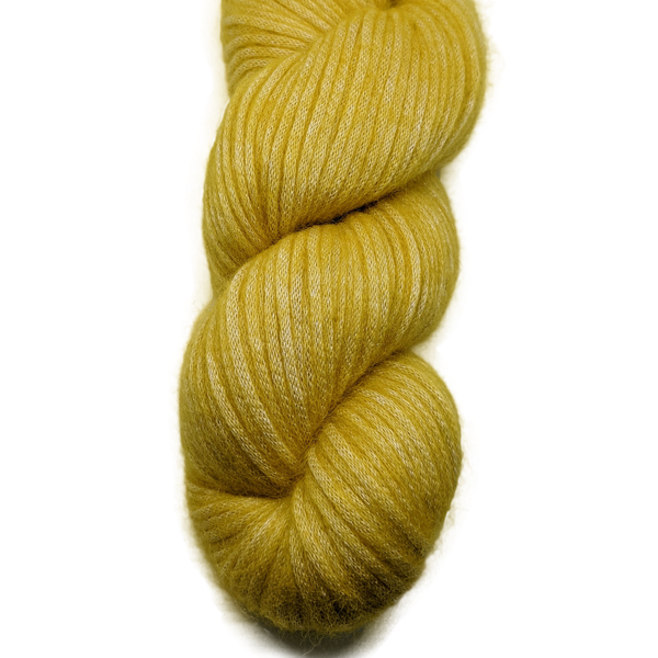 Yellow skein of yarn on a white background