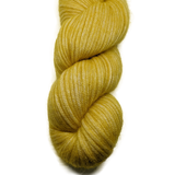 Yellow skein of yarn on a white background