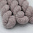 Pink yarn skeins on a white background