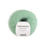 Green skein of Tukuwool Silk Mohair yarn on a white background